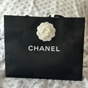 Chanel shopping bag and box used to hold sunglasses